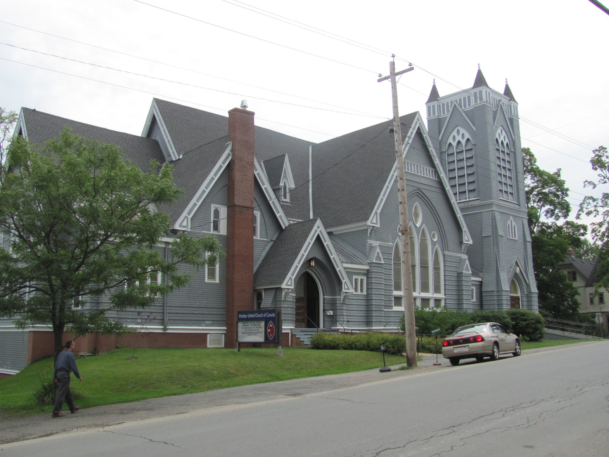 the exterior of a church beside a road