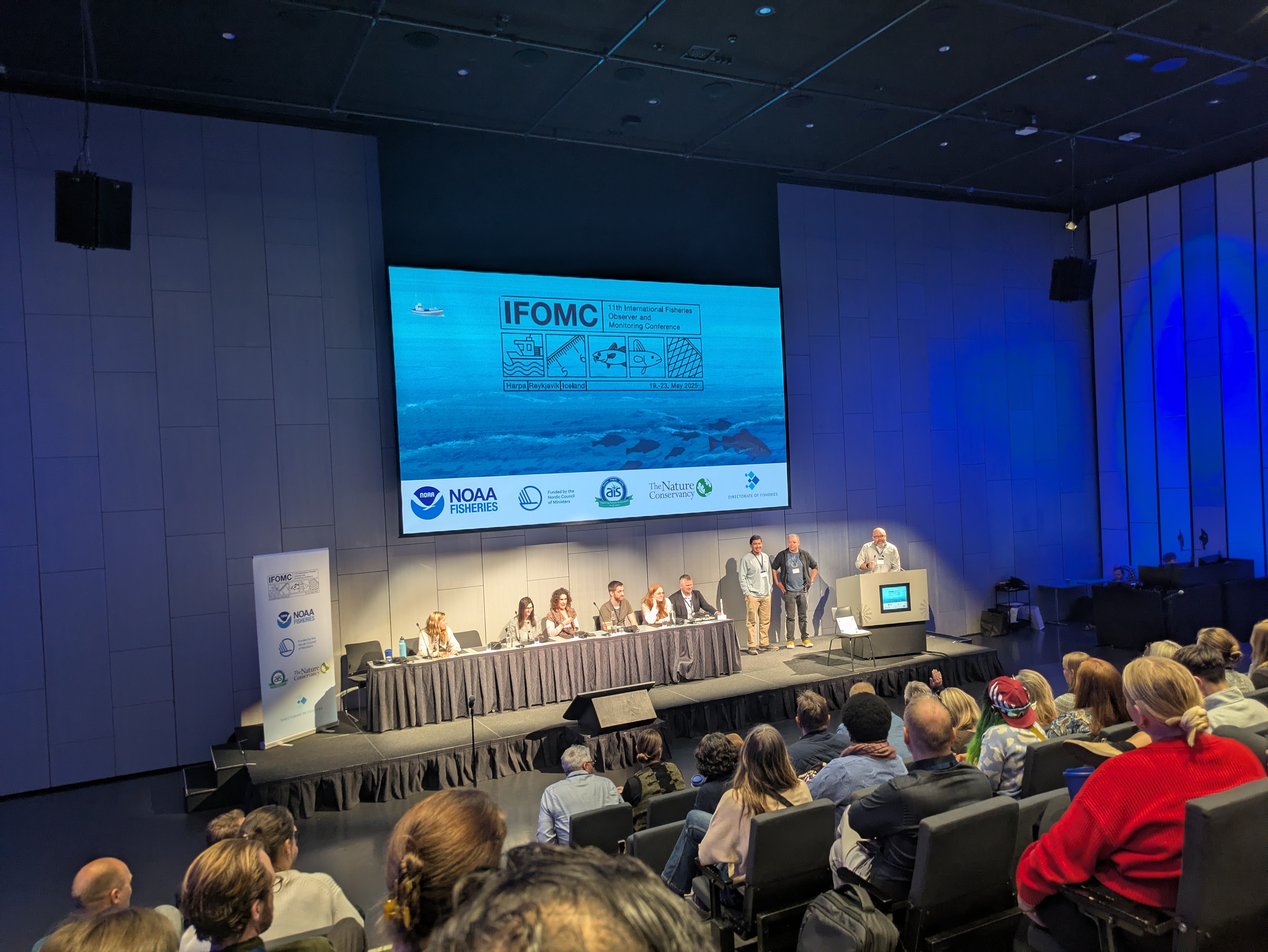 Big-screen presentation at a fisheries conference