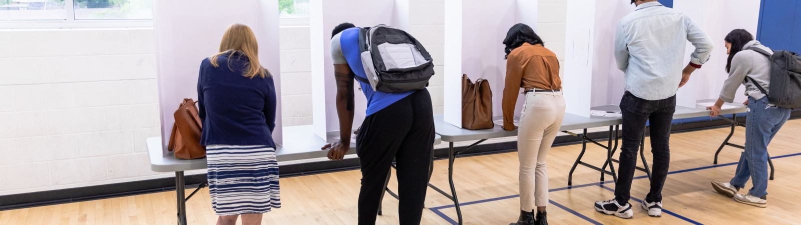 five people at a polling station