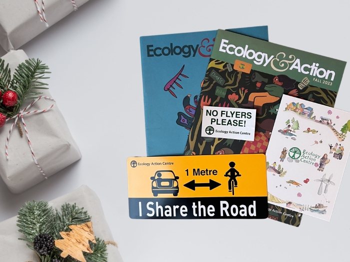 two ecology & action magazines, a i share the road magnet, a no flyers sticker and some presents.