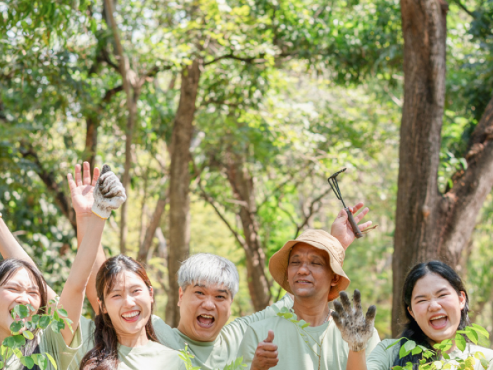 People of many ages and backgrounds outside cheering